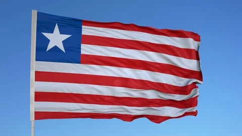 Looping flag for Liberia on flag pole, blowing beautifully in the wind. Includes Video stock 79774370