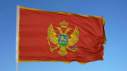 Looping flag for Montenegro on flag pole, blowing beautifully in the wind. Vídeo Stock 79774471