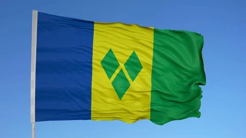 Looping flag for St Vincent Grenadines on flag pole, blowing beautifully in the Vídeo Stock 79807473
