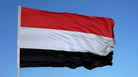 Looping flag for Yemen on flag pole, blowing beautifully in the wind. Includes 動画素材 79774139