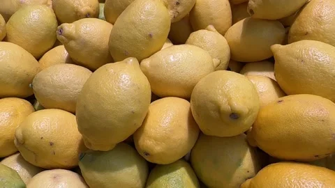 Looping lemons background with fresh yellow citrus texture Stock Footage 324684729