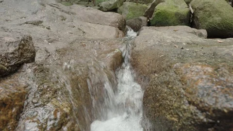 Looping Mountain Stream Flowing Between Rocks with White Water Stockbeeldmateriaal 334019564