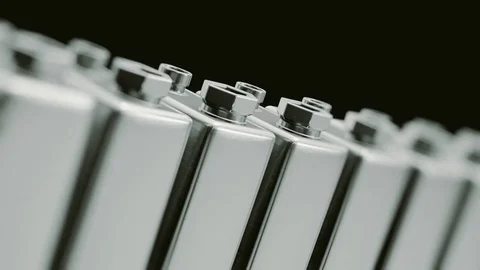 Looping Pan over an Endless Line of Chrome 9 Volt Batteries 库存影片 77576033