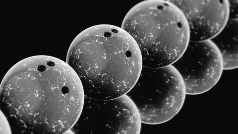 Looping Pan over an Endless Line of Black Bowling Balls 库存影片 77577529