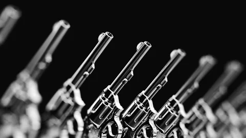 Looping Pan over an Endless Line of Upright Revolvers 库存影片 77584157