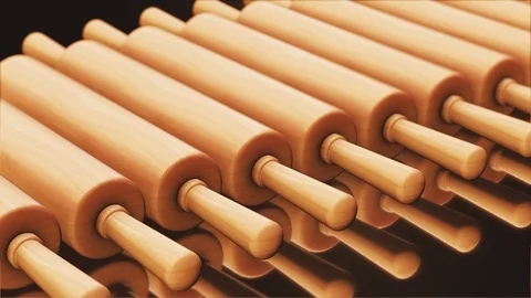 Looping Pan over an Endless Line of Wood Rolling Pins 库存影片 77584185