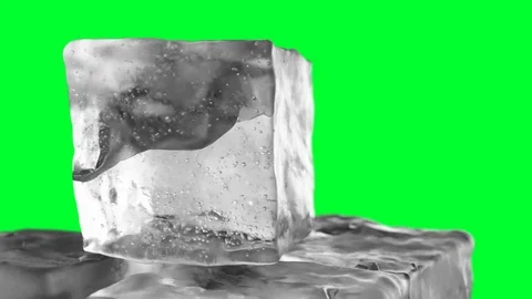 Looping rotation of ice cube on a green ... | Stock Video | Pond5