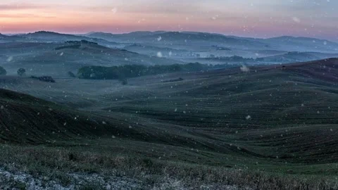 Looping snow falling background video in green valley in mountains. Stock Footage 138977240