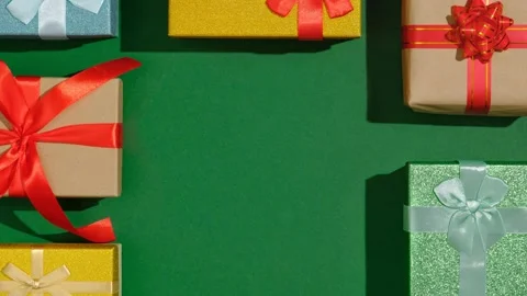 Looping stop motion animation with colorful Christmas gift boxes and copy space Stock Footage 253977827