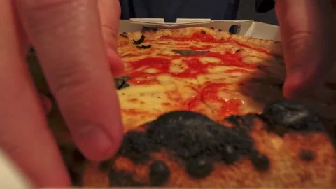Looping time lapse of man eating Neapolitan style Margherita pizza from Stock Footage 334044360