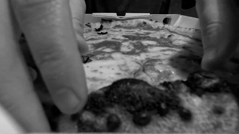 Looping time lapse of man eating Neapolitan style Margherita pizza from Stock Footage 334044400