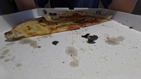 Looping time lapse of man eating Neapolitan style Margherita pizza from Stock Footage 334044470