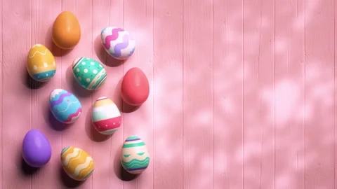 Looping video of painted easter eggs on a wooden pink table animated in sto.. Stock Footage 303634835