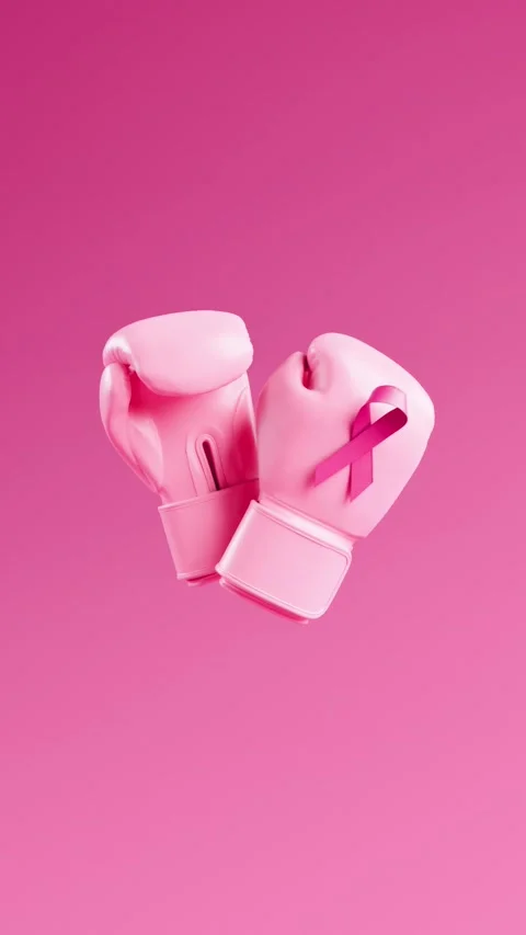 Looping video of pink boxing gloves with breast cancer awareness ribbon flo.. Video stock 314775349