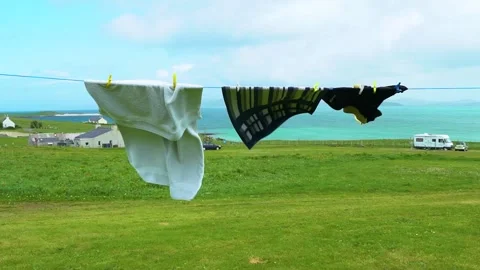 Looping Wind Waves the Towels on the Airer on the Campsite Stock Footage 156311268