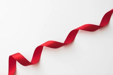 Loops of red  ribbon on gray text place - Image Stock Photos