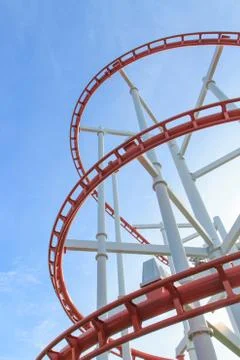 Loops of roller coaster under blue sky Foto stock