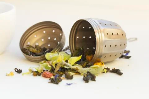 Loose herbal tea in tea strainer Stock Photos