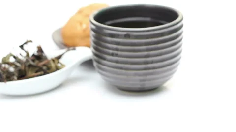 Loose Tea And Cup Of Tea, Rotation Of Tea on white background Stock Footage 41907502