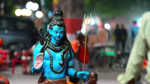 Lord Shiva Statue with Trident at Hindu Religious Festival Night Scene Stock Footage 339724734