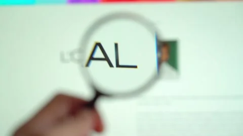 LOREAL on logo is visible on the display screen through a magnifying glass. Stock Footage 153100479