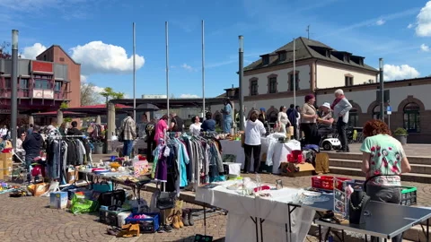 At the Lörrach flea market in front of the train station in the spring Stock Footage 336025442