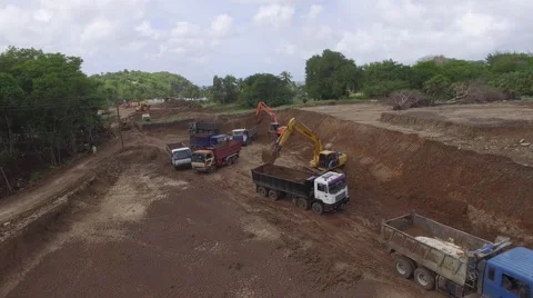 Lorries and diggers on construction site Stock Footage 63451395