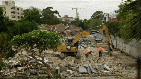Lorries arrive to take away rubble on new redevelopment time lapse 4K Stock Footage 325754069