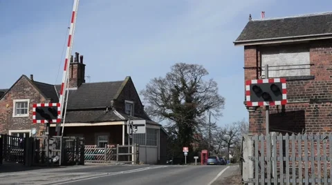 Lorry driver waiting at railway level crossing at Howden station united kingdom Stock Footage 48966063