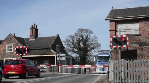 Lorry driver waiting at railway level crossing at Howden station united kingdom Stock Footage 48966961