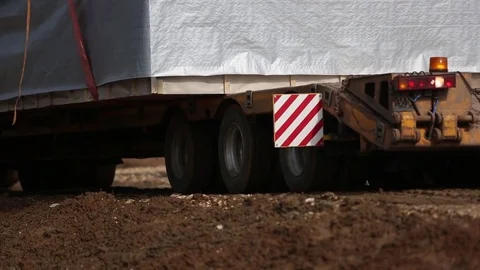 Lorry trucking load wheel close-up, truck transports oversized cargo Stock Footage 79654385