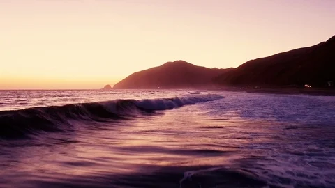 Los Angeles Aerial Drone Flyover of Malibu beach at sunset Stock Footage