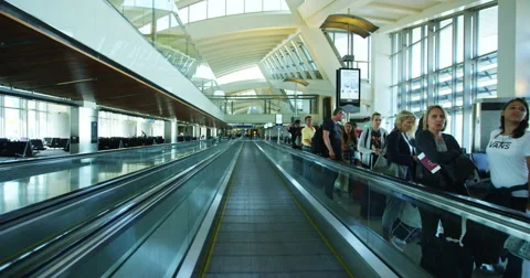 LOS ANGELES, CALIFORNIA - CIRCA 2016: Passengers walk through the internatio Stock Footage