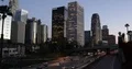 Los Angeles City Downtown Office Towers and Car Traffic Jam on Busy Freeway Dusk 4k or 4k+ Resolution