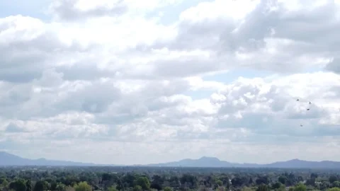 Los Angeles clouds with bird flying by 動画素材 283663514