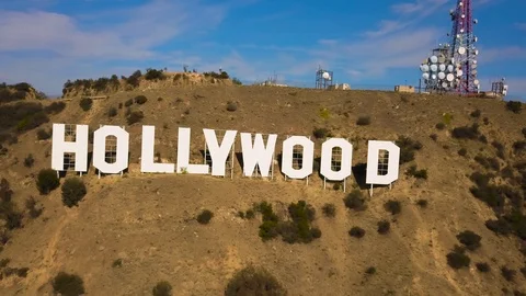 Los Angeles establishing shot Hollywood Sign pull out aerial Stock Footage