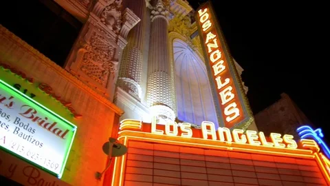 Los angeles theatre exterior night neon sign establishing pan Stock Footage