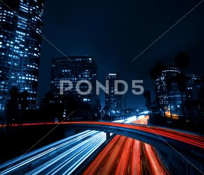 Los angeles, urban city at sunset with freeway trafic Stock Photos