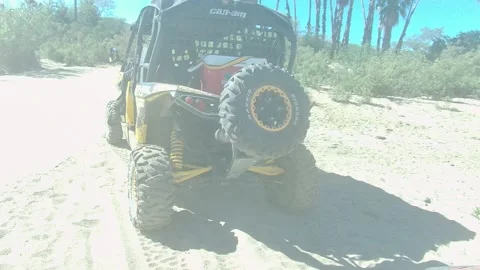 LOS CABOS BCS MEXICO-2022: Yellow Jeep Driving on Sunny Coastal Road Stock Footage 204889649