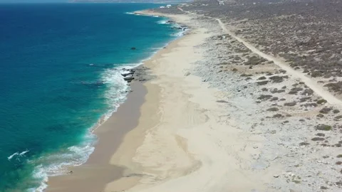 LOS CABOS MEXICO-2020: The Seashore With Tiny Cute Waves Reaching The White Sand Stock Footage 134426732