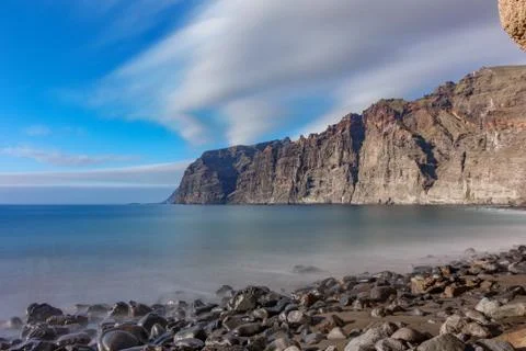 Los guios stone beach looking to Los Gigantes cliffs in Tenerife Stock Photos