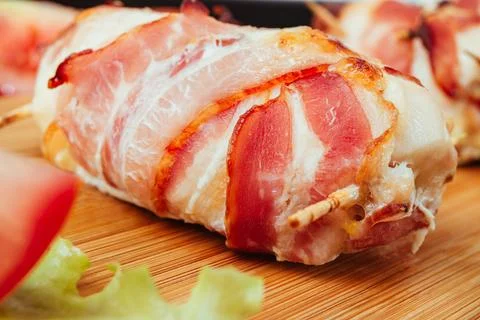 Lose-Up of Bacon Wrapped Chicken Roll on Board Stock Photos