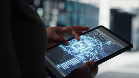 Lose up of data center technician doing AI data analysis on tablet Stock Footage 317125763