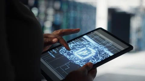Lose up of data center technician doing AI data analysis on tablet Stock Photos