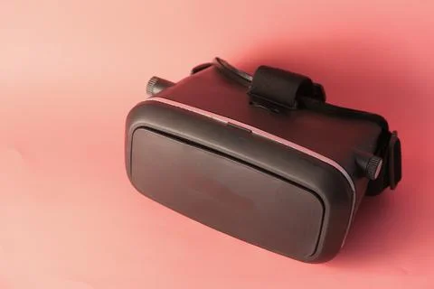 Lose up of virtual reality headset, vr box on pink background Stock Photos
