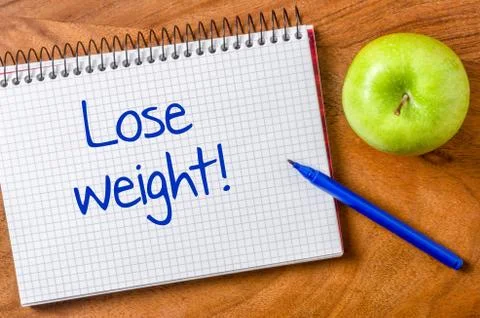 Lose weight written on a notepad 库存照片