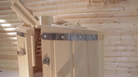 Loseup cedar phytobarrel. Inside, grates on floor,back and seat, and handstands Stock Footage 154243199