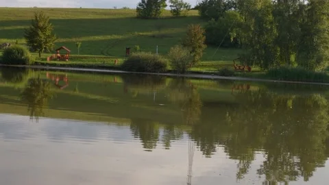 Losing a fish getting unhooked on the surface of the lake Stock Footage 228640907