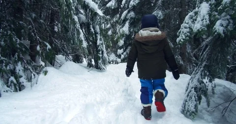 Lost Boy walking on the snow. Stock Footage 100656116