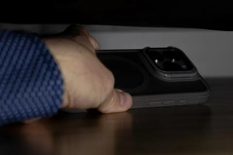 Lost cell phone under the couch, man looking for lost phone, Stock Photos